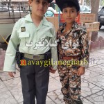 تصویر دو پسر بچه کرمانشاهی در لباس نظامی